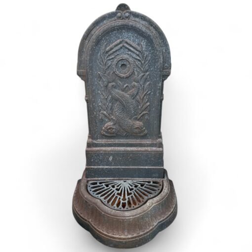 Cast iron fountain with mythical fish motif.