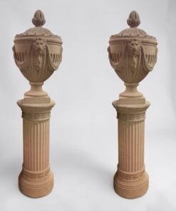 Neoclassical Lion Head Urns on Pedestals